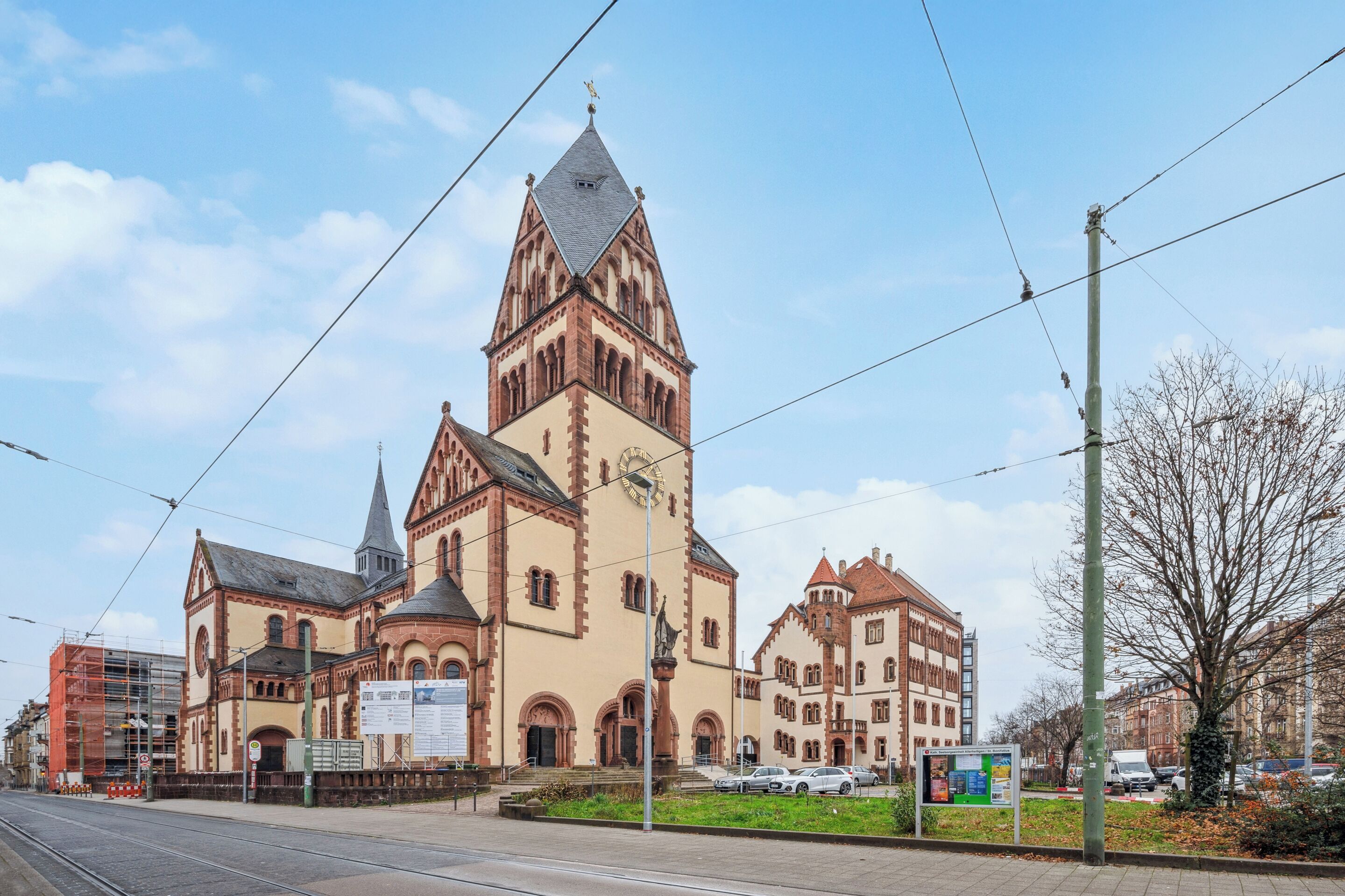 A historic church with a prominent tower and a large clock.
