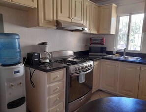 Fridge, microwave, stovetop, cookware/dishes/utensils
