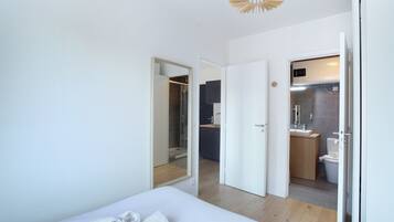 Apartment | Laptop workspace, iron/ironing board, bed sheets