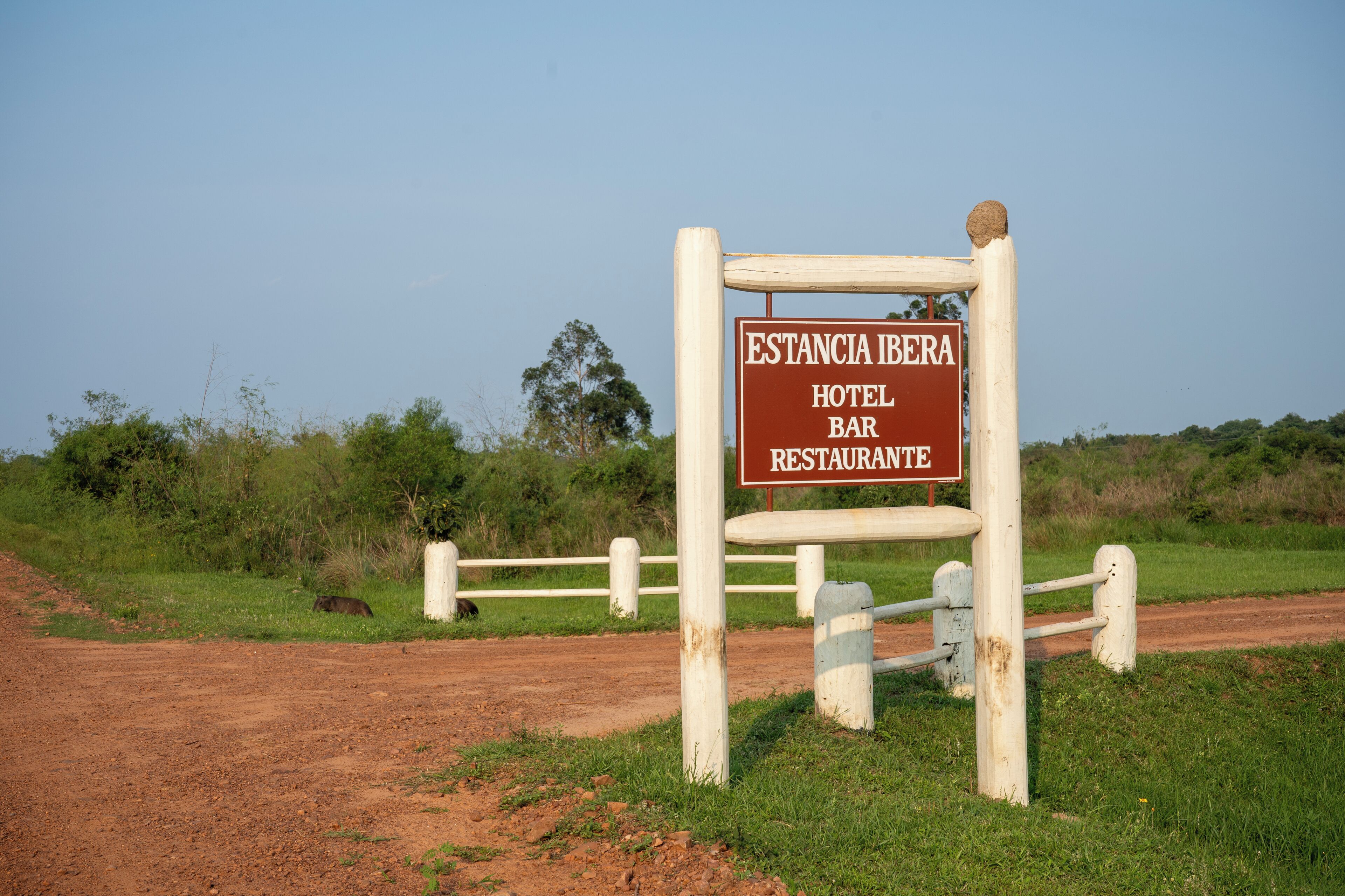 A sign for Estancia Ibera Hotel Bar Restaurant.