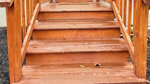 A wooden staircase leading to a white door with a window above it, flanked by two wooden railings. - 2Bed1 bath Near Ithaca &Cornell lower unit (Locke)