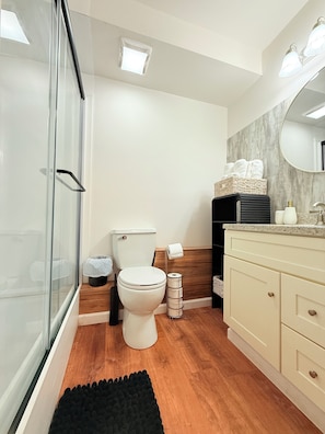 Shower, hair dryer, towels, soap
