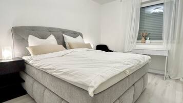 1 bedroom, desk, iron/ironing board, travel crib