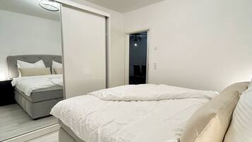 1 bedroom, desk, iron/ironing board, travel crib