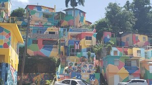 A multi-story building with colorful geometric patterns and balconies.