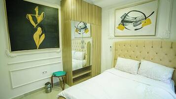 Economy Apartment, Balcony, City View | 3 bedrooms, in-room safe, desk, laptop workspace