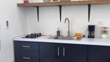 Fridge, microwave, stovetop, coffee/tea maker