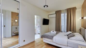 Apartment | Laptop workspace, iron/ironing board, bed sheets