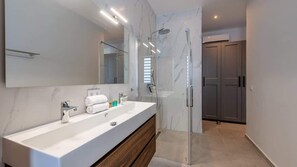 Shower, hair dryer, towels, soap - The Breeze 50 | Island Breeze Living (Blue Bay Golf and Beach Resort)