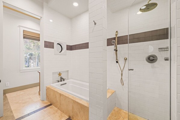 A modern bathroom with a bathtub, a shower with a rain showerhead, and a window with blinds. - Near Beach Access and Dining | Pool (Santa Rosa Beach)