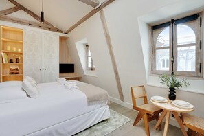 Departamento | 1 habitación, tabla de planchar con plancha y ropa de cama 