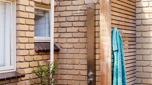 A brick exterior wall with a window and a door. - Pet Friendly - Captain Sandy on the Loop Blairgowrie (Blairgowrie)