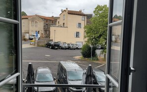 A parking lot with several cars and a building in the background. - Our establishment is located not far from Clermont-Ferrand in the charming littl (Saint-Saturnin)