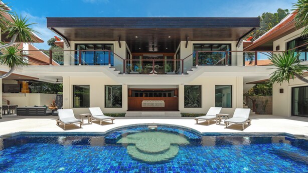 A modern house with a swimming pool, two balconies, and a covered outdoor area. - Naiharn 4br Private PoolVilla near Beach (Rawai)