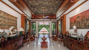A spacious lobby with a high ceiling, ornate ceiling design, and a central fountain. - Naiharn 4br Private PoolVilla near Beach (Rawai)