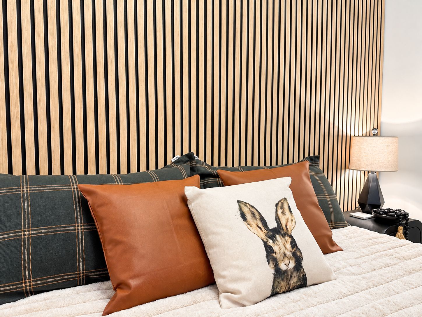 The KING bedroom features a 14" plush mattress and a 55-inch smart TV.
