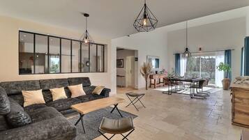 Villa, Garden View | Living area | 120-cm LED TV with cable channels