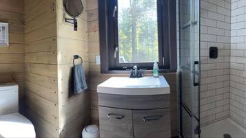 Shower, towels, soap, toilet paper