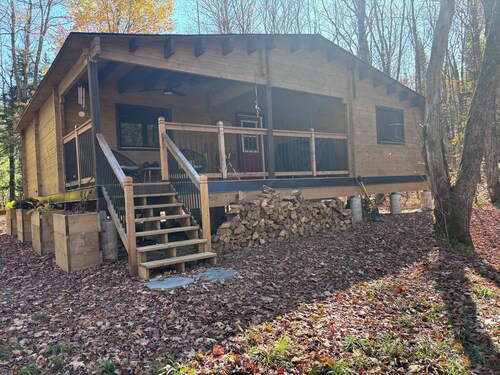 Riverside cabin in the woods