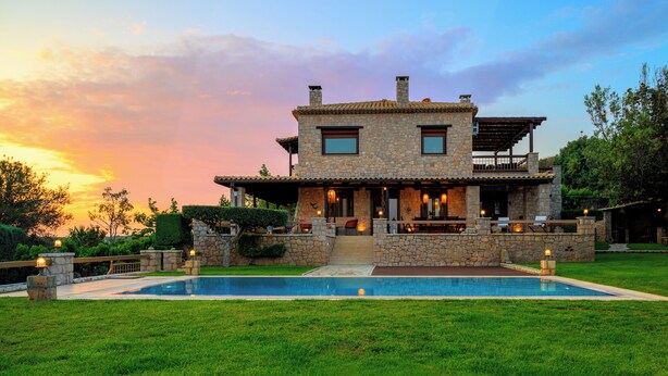 A stone house with a pool, outdoor seating, and a covered patio. - Villa Vicanti: Private Paradise (Mesochori)
