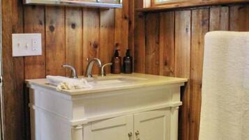 Shower, towels, soap, toilet paper