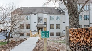 A multi-story building with a sign indicating unit numbers 1598-1594, 1597-1593, 1596-1592, and 1595-1591. - Mountain View Vista: Resort Condo w/ Views (Wintergreen Resort)