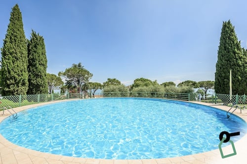 Seasonal outdoor pool, open 10:00 AM to 7:00 PM, pool umbrellas