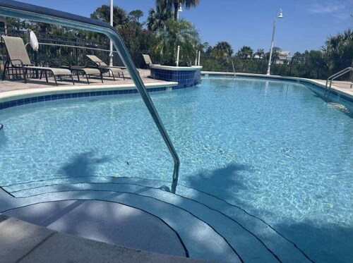 Relaxing coastal condo with tranquil views, a spacious deck, vibrant sunsets and sugar-white sands.