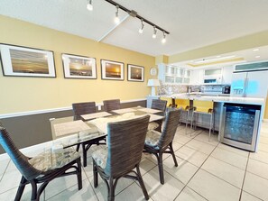 A modern kitchen with white cabinets, a built-in oven, and a dishwasher.