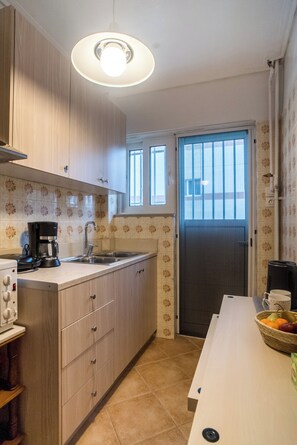 Microwave, coffee/tea maker, toaster, cookware/dishes/utensils