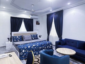 Deluxe Double Room, 1 King Bed, Non Smoking | Living area | 48-inch Smart TV with digital channels