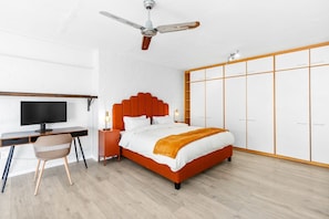 A bedroom with a bed, desk, chair, wardrobe, and ceiling fan. - The Studios 309 - One Bedroom Apartment, Sleeps 2 (Cape Town)