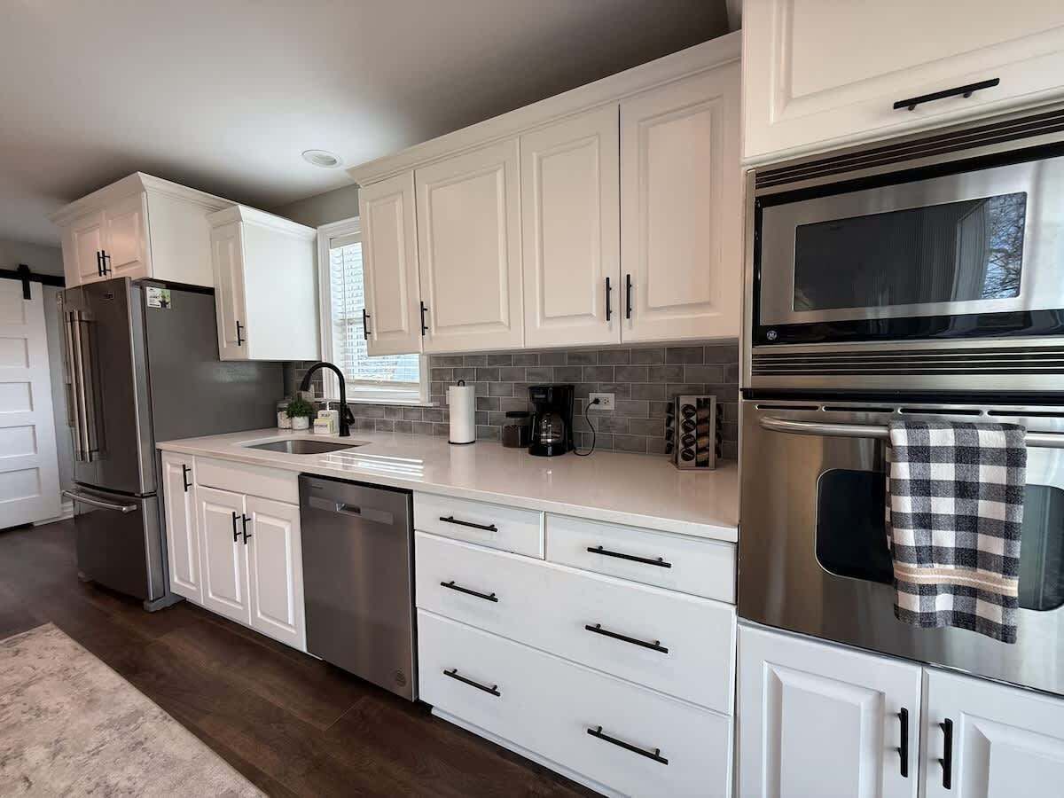 Bright, fully stocked kitchen with stainless steel appliances and everything you need for cooking during your stay.