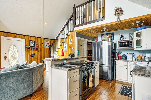Enjoy cooking in the well-appointed kitchen with a central island and modern appliances.
