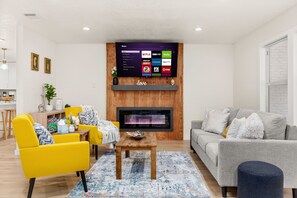 Smart TV, fireplace, books