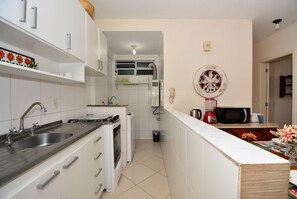 Fridge, microwave, oven, cookware/dishes/utensils