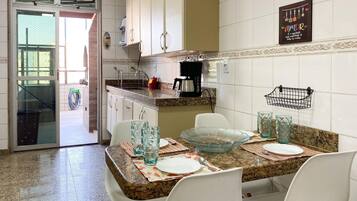 Fridge, microwave, oven, cookware/dishes/utensils