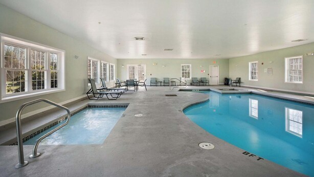 An indoor swimming pool with multiple lanes, seating areas, and a lifeguard station. - RARE 3 Bedroom at the Resort at Goose Rocks Beach (Kennebunkport)