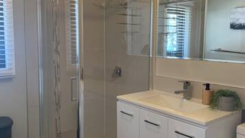 Shower, towels, soap, toilet paper