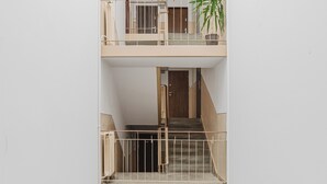 A multi-level apartment with a staircase connecting the floors.