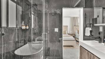 Shower, eco-friendly toiletries, hair dryer, towels