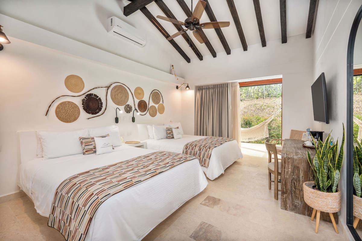 Quadruple Room, 2 Double Beds | Free minibar, in-room safe, desk, blackout curtains