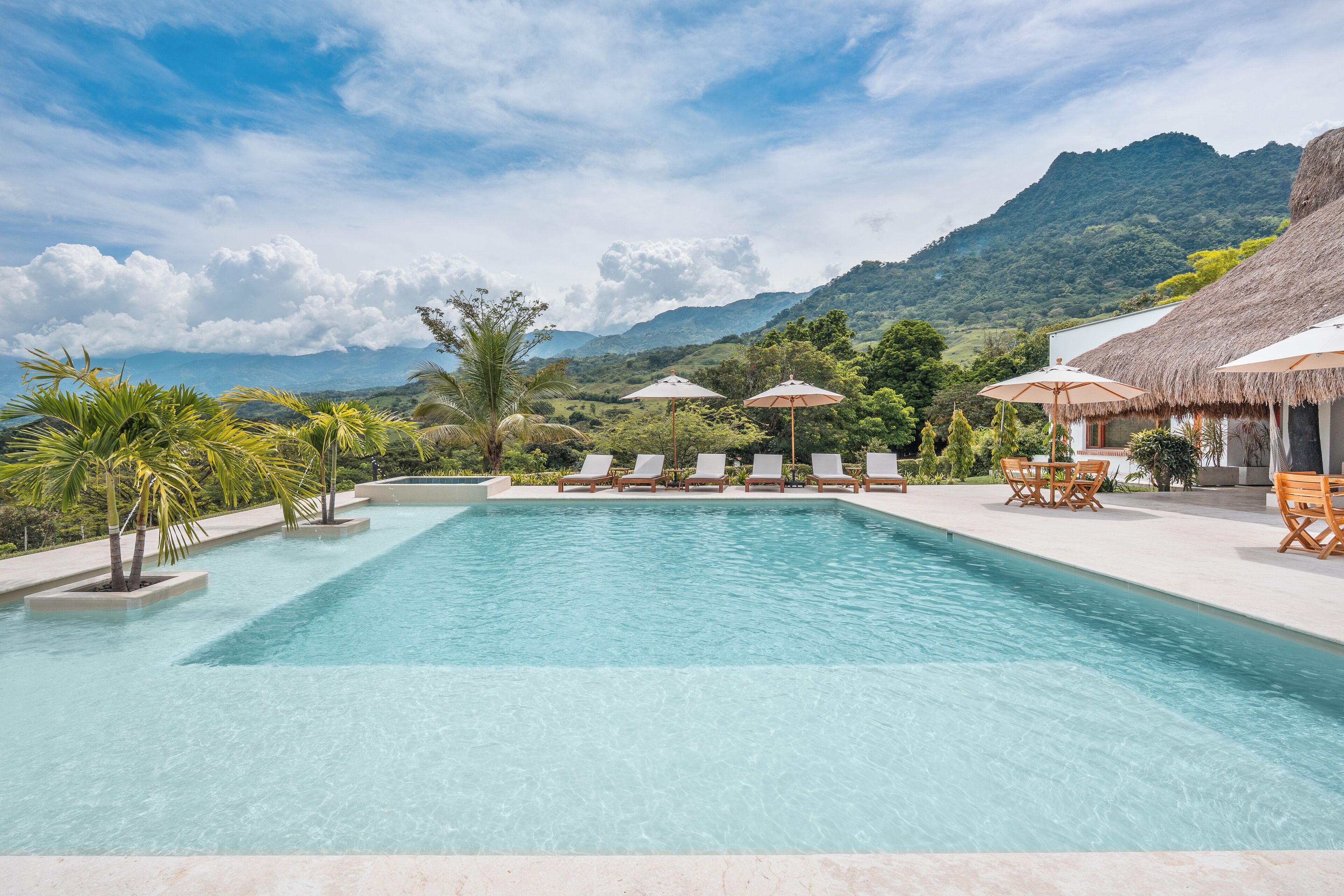 Outdoor pool, pool umbrellas, sun loungers