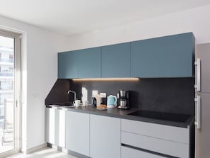 Microwave, dishwasher, highchair, dining tables