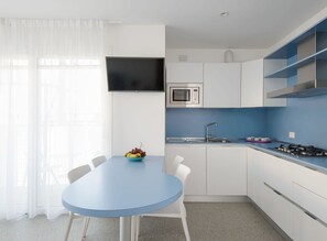 Microwave, dishwasher, highchair, dining tables