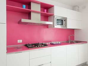 Microwave, dishwasher, high chair, dining tables