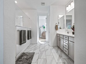 Shower, hair dryer, towels, soap