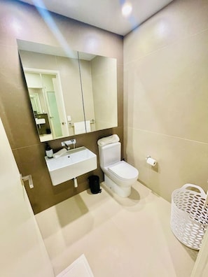 Shower, hair dryer, towels, soap