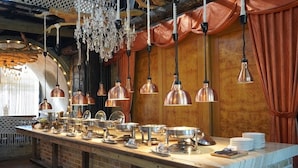 A buffet setup with copper-toned hanging lights, a brick counter, and a wooden backdrop. - OrangeFarmerlife (Zhuolan)