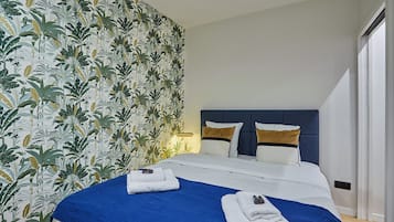 Apartment | Laptop workspace, iron/ironing board, bed sheets